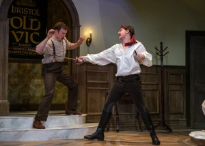 Benjamin Sterling, right, as Tony Cavendish (John Barrymore?) mock-dueling with the personal trainer (Ryan McCarthy).